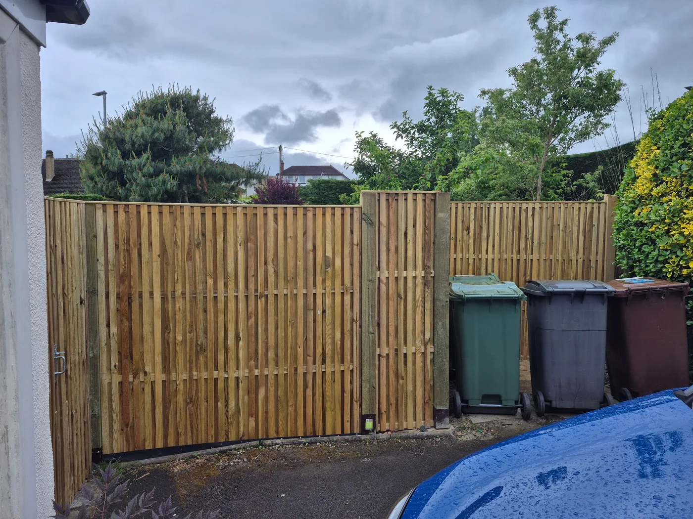New timber fence and gate creating a garden boundary